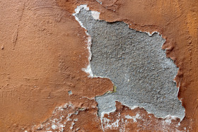 Stock Image: Red grunge weathered exterior wall texture