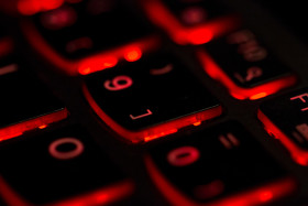 Stock Image: Red led light computer laptop keyboard