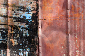 Stock Image: Red Rusty Metal Texture with Coloured Spills