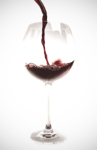 Stock Image: Red wine is poured into a wine glass