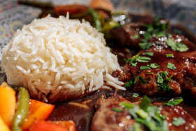 Stock Image: Rice and lamb steaks in an arabic restaurant