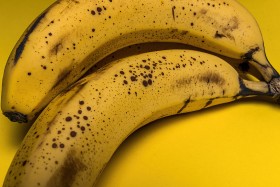 Stock Image: ripe bananas yellow background