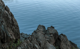 Stock Image: rock in blue water