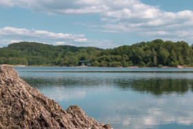 Stock Image: rock in lake - landscape in germany nrw wuppertalsperre