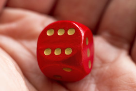 Stock Image: Roll the dice - six diced in hand