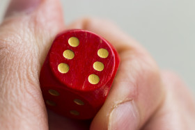 Stock Image: Roll the dice - six diced in hand