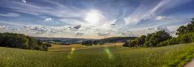 Stock Image: Rural Landscape in Germany with the Sun in the middle during the golden hour