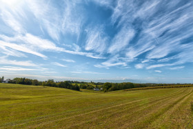 Stock Image: rural landscape with field and blue sky, wuppertal ronsdorf, nrw germany
