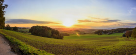 Stock Image: Rural Sunset over hilly fields Panorama - Velbert Langenberg