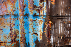 Stock Image: Rusty metal texture with blue paint residue