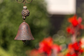 Stock Image: rusty old bell in garden