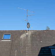 Stock Image: Satellite Dish and Antenna TV on Blue Sky