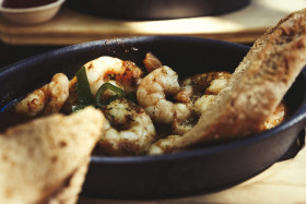 Stock Image: scampis in oil with baguette slices