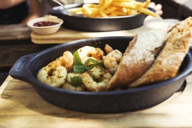 Stock Image: scampis in oil with baguette slices