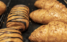 Stock Image: Self-service croissants in a bakery filled with chocolate
