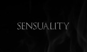 Stock Image: sensuality as a silver word on black background