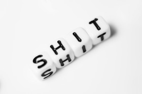 Stock Image: shit as a word - bright dice font concept
