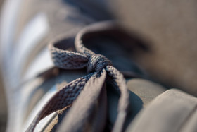 Stock Image: Shoelaces tied to the loop on the shoe