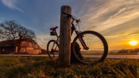 Stock Image: short break from cycling to enjoy the sunset