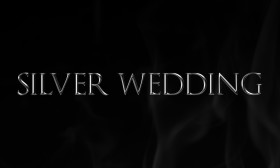 Stock Image: silver wedding as a word on black background
