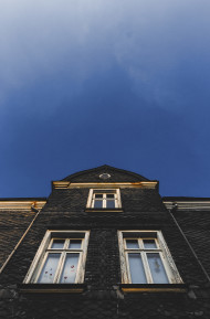 Stock Image: Slate stone house under blue sky