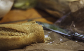 Stock Image: sliced baguette on a garden table