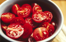 Stock Image: sliced cherry tomatoes in a bowl