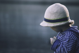 Stock Image: small boy looks on water