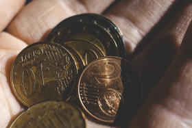 Stock Image: small change euros in hand