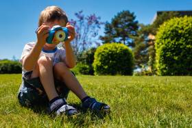 Stock Image: Small child with child camera