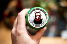 Stock Image: Soft Drink Can in a Hand