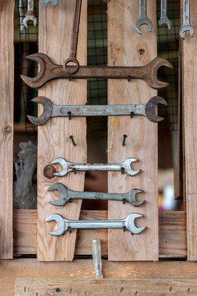 Stock Image: Spanner on a wooden wall