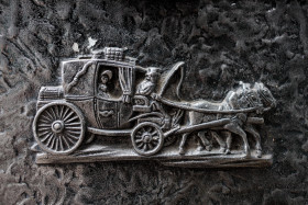 Stock Image: Stagecoach metal symbol