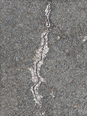 Stock Image: Street texture with a huge crack