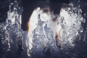 Stock Image: summer cooling fountain water splash