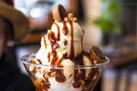 Stock Image: sweet caramel ice cream cup in an ice cream parlor