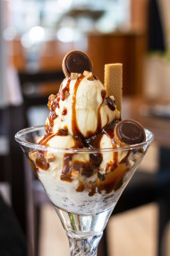 Stock Image: sweet caramel ice cream cup in an ice cream parlor