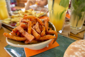 Stock Image: sweet potato french fries in a restaurant