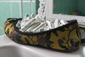 Stock Image: tampons in the shoe in the bathroom