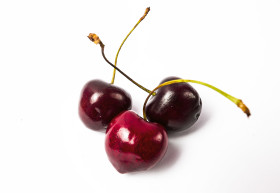 Stock Image: three cherries isolated on white background