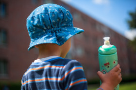 Stock Image: Toddler with plastic water bottle