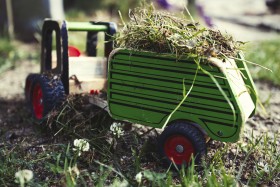 Stock Image: toy tractor loaded with grass