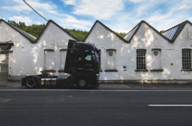 Stock Image: truck in front of an old factory