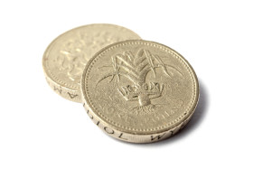 Stock Image: Twice british one pound coins isolated on white background