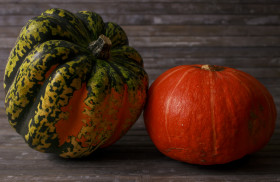 Stock Image: Two pumpkin on wooden background