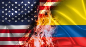 Stock Image: USA vs Colombia burning Flag - conflict war comparison on fire illustration