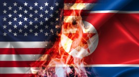 Stock Image: USA vs North Korea burning Flag - conflict war comparison on fire illustration