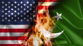 Stock Image: USA vs Pakistan burning Flag - conflict war comparison on fire illustration