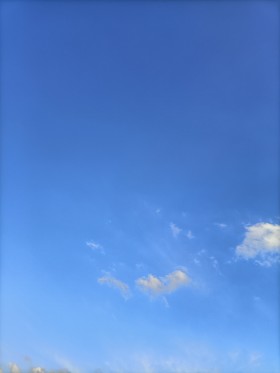 Stock Image: Vertical Blue Sky with some Clouds for Sky Replacement