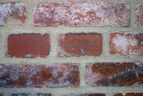 Stock Image: Weathered stained old brick wall
